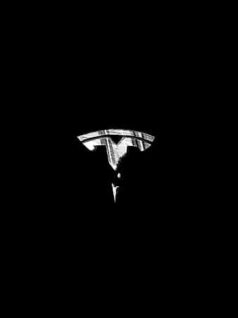 Tesla-logo i levende 4K-opløsning. Wallpaper