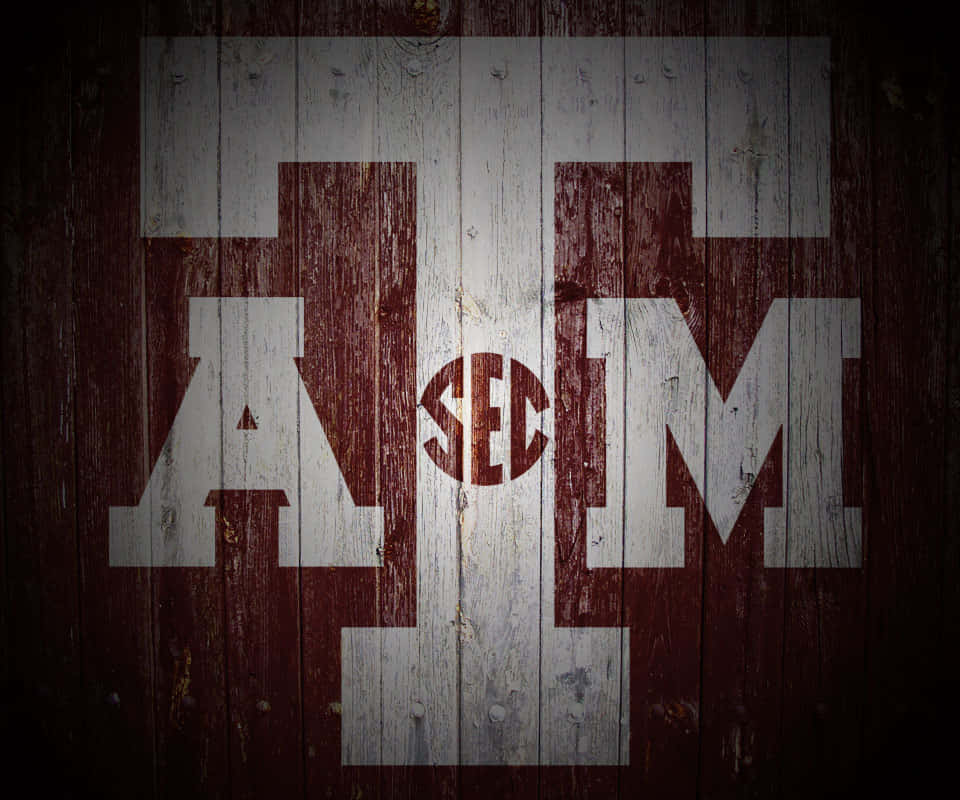 Texas A&m Aggies Logo On A Wood Background Wallpaper