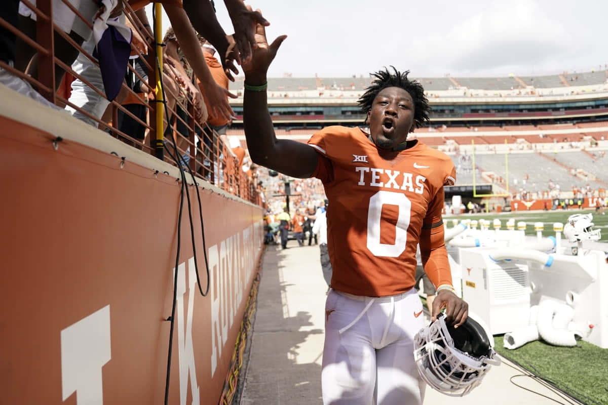 Texas Voetballer High Fiving Fans Achtergrond