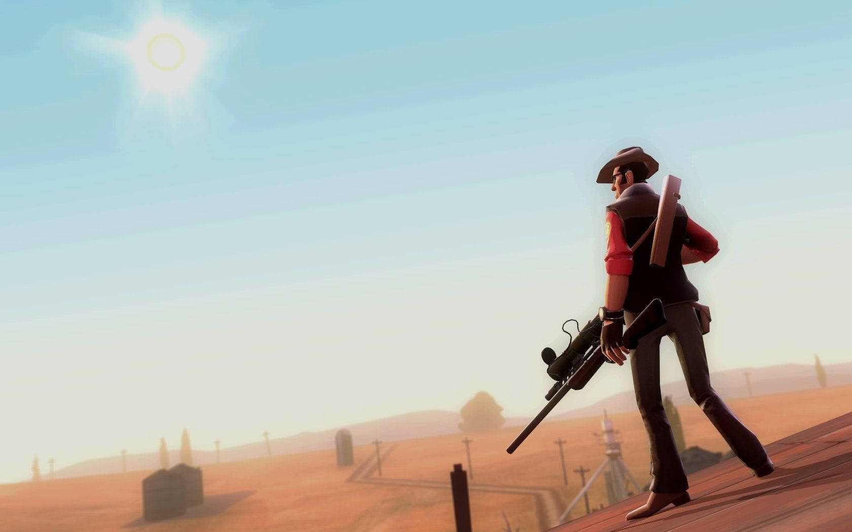 A Man With A Gun Is Standing On A Hill Wallpaper