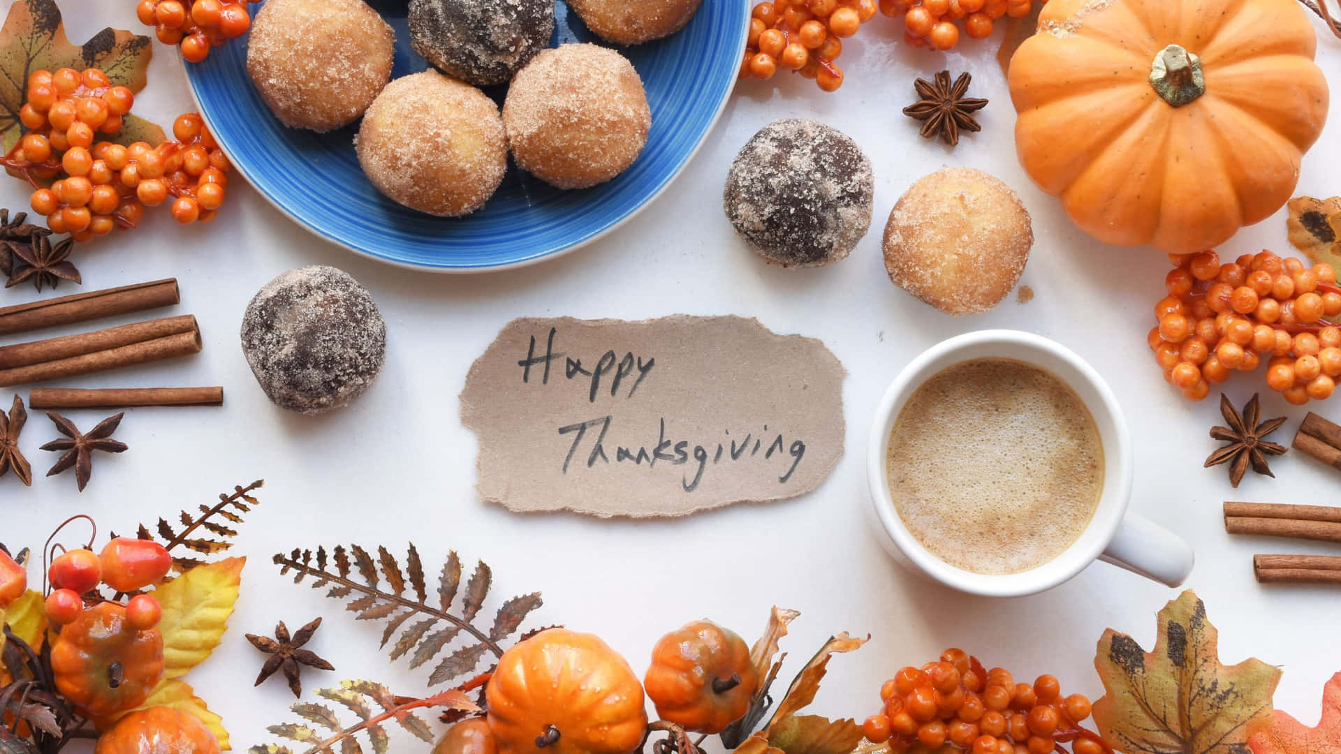 A Cup Of Coffee And Donuts With The Words Happy Thanksgiving Wallpaper