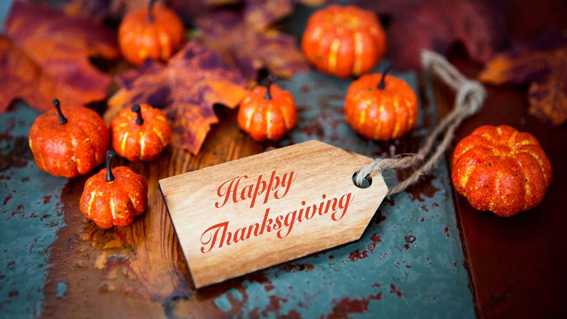 Happy Thanksgiving Wooden Tag With Pumpkins And Leaves Wallpaper
