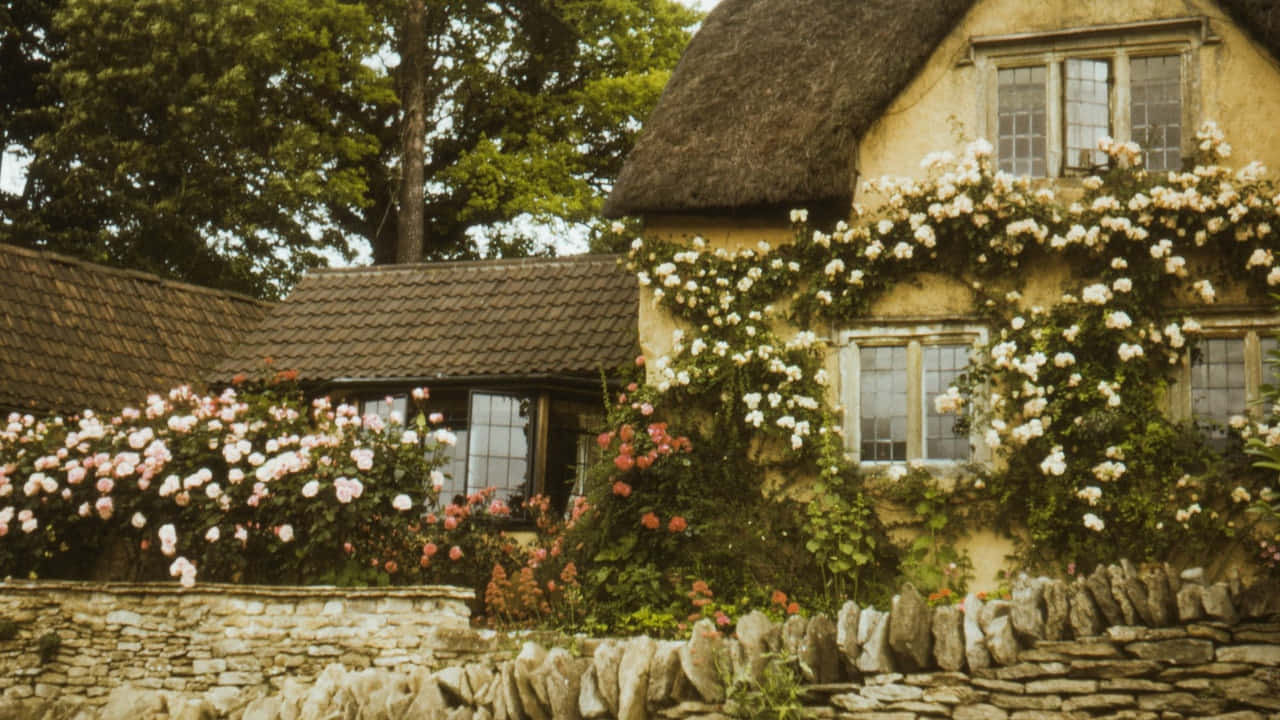 Thatched Roof Cottagewith Roses Wallpaper