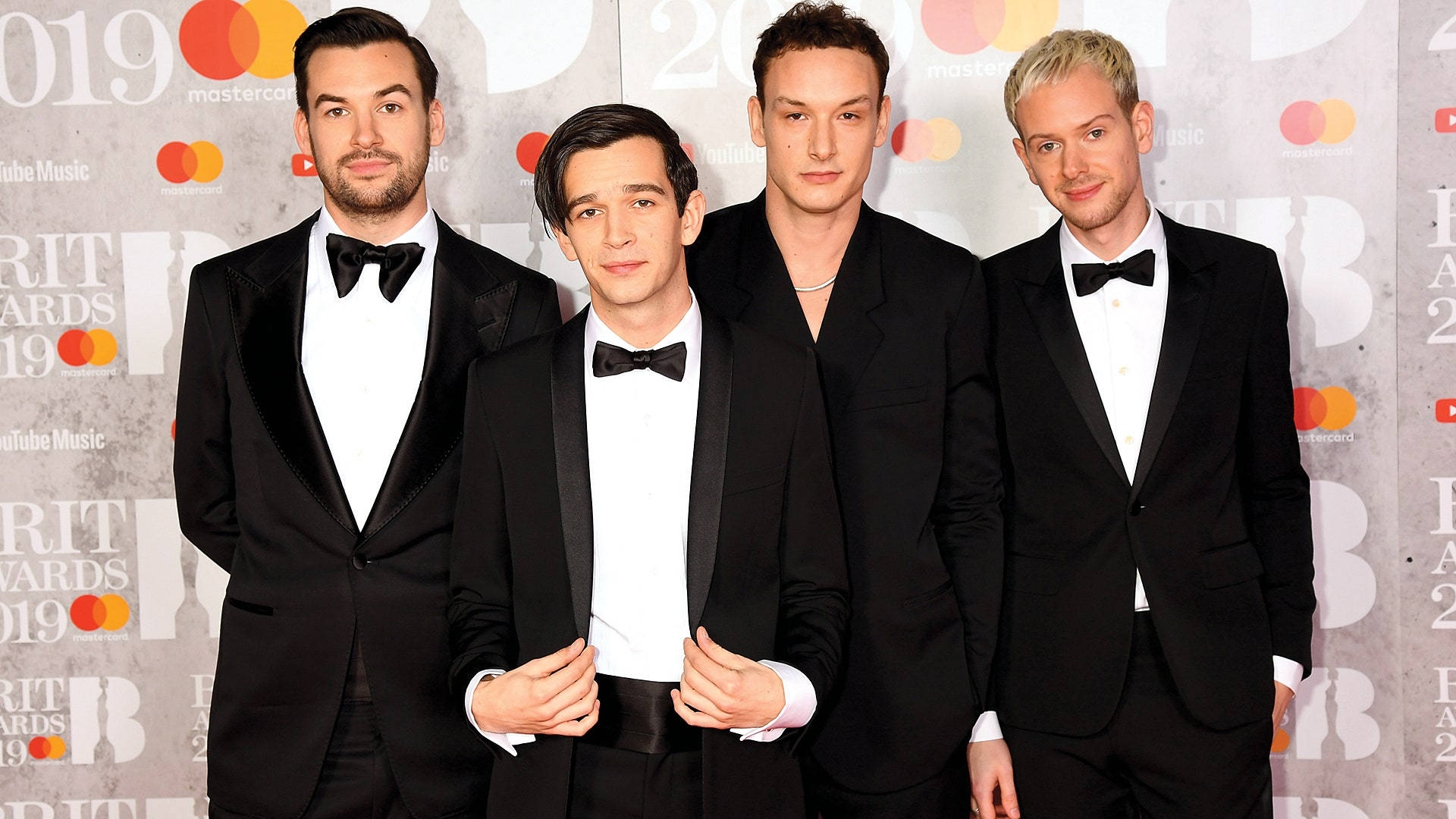 The 1975 Band In Tuxedo Suit Wallpaper
