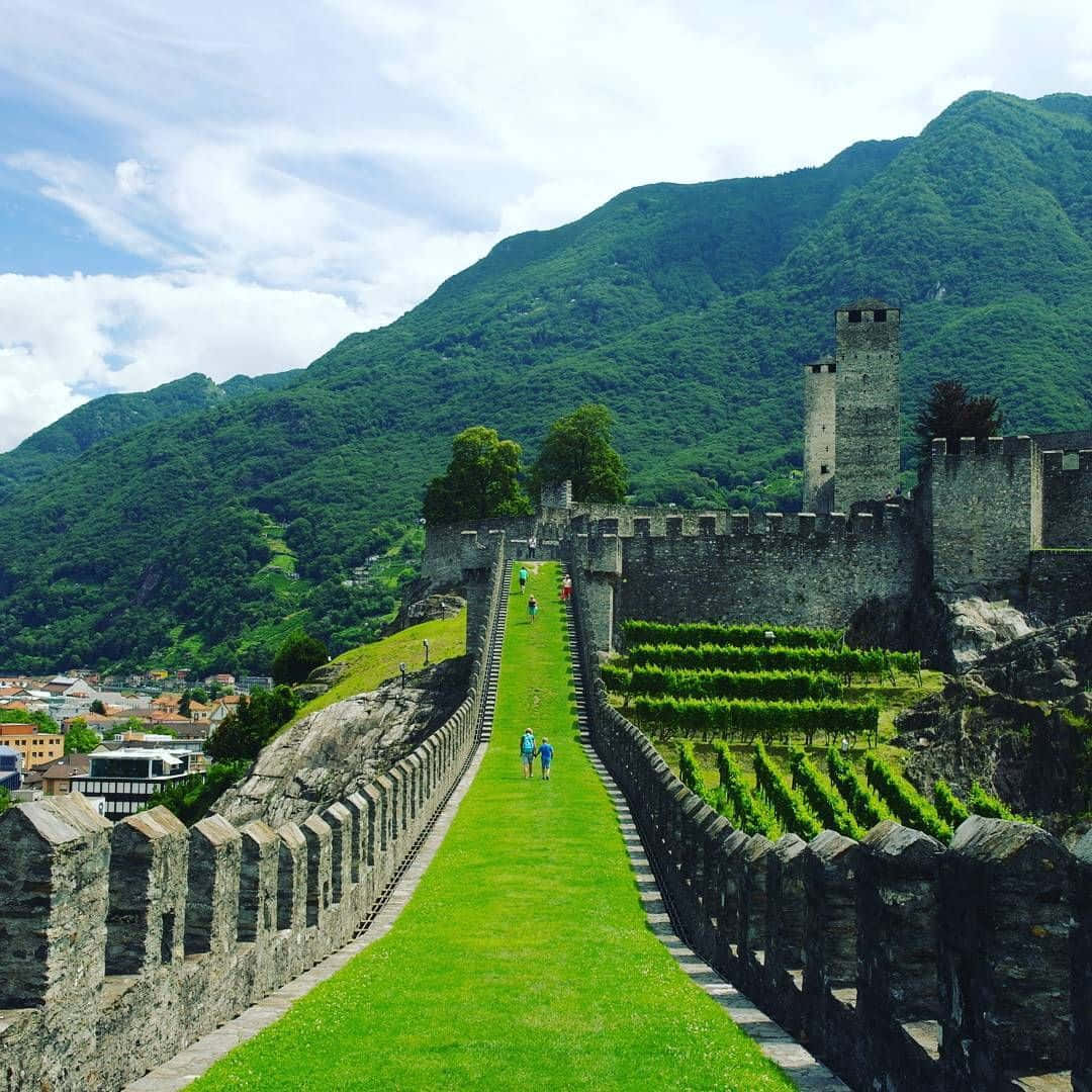 The Breathtaking View Of Bellinzona's Three Castles At Sunset Wallpaper