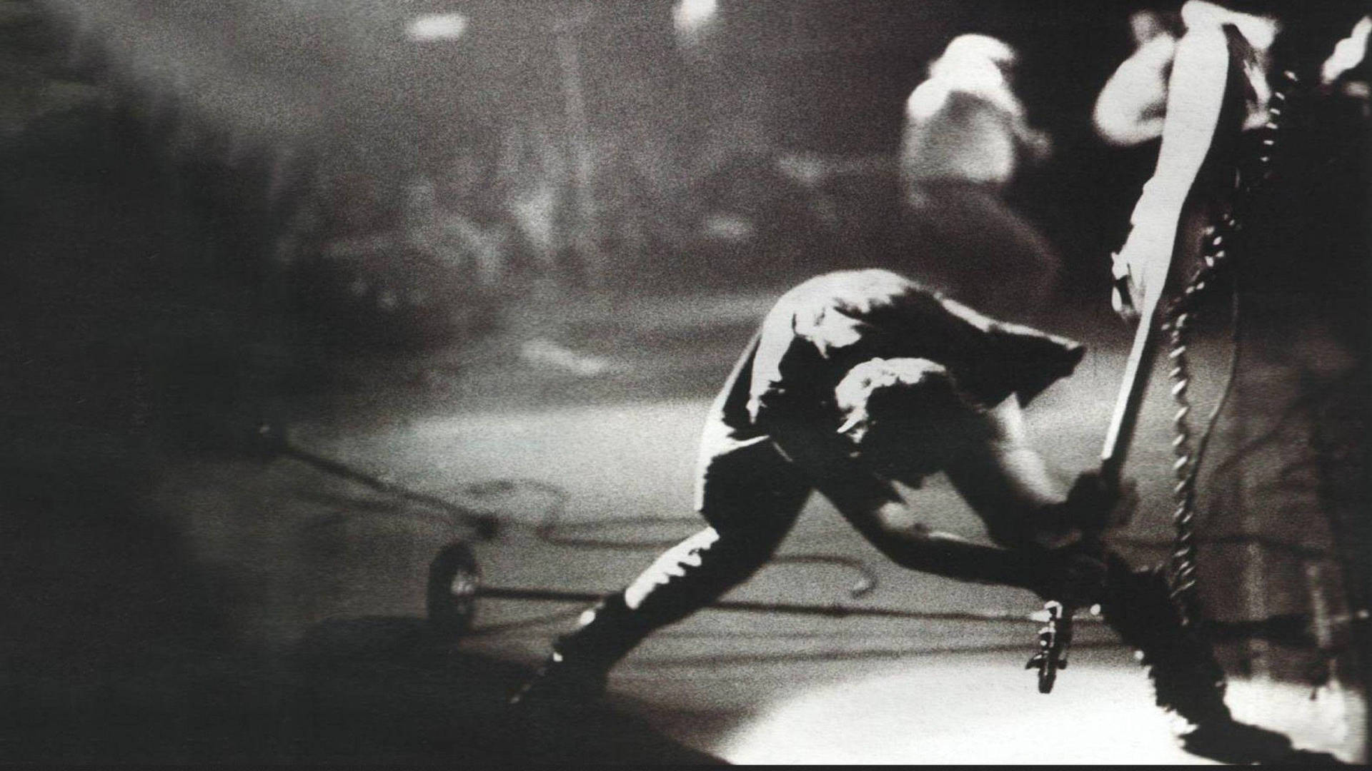 The Clash Paul Simonon Smashing Guitar Wallpaper