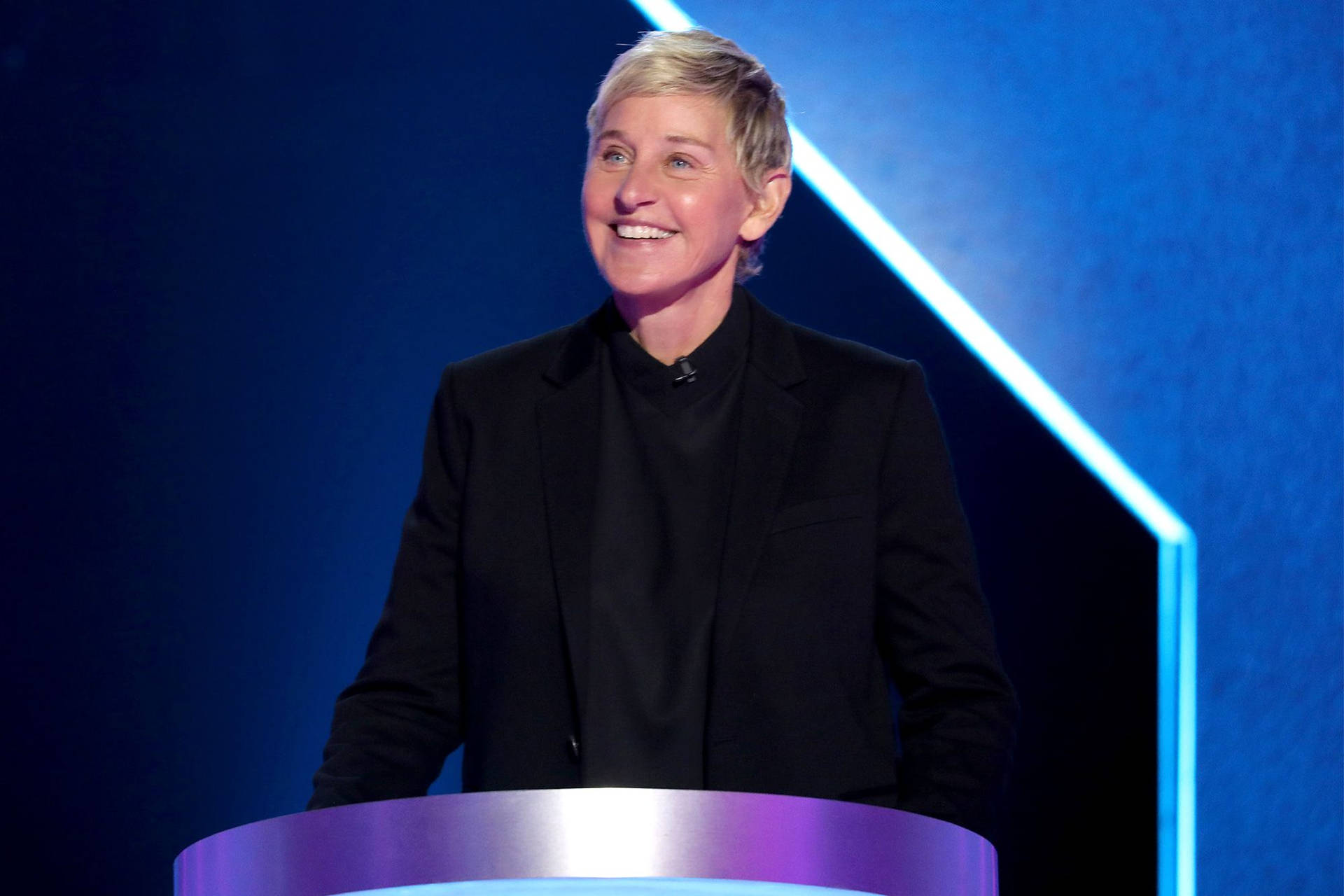 The Ellen Show Host In A Podium Background