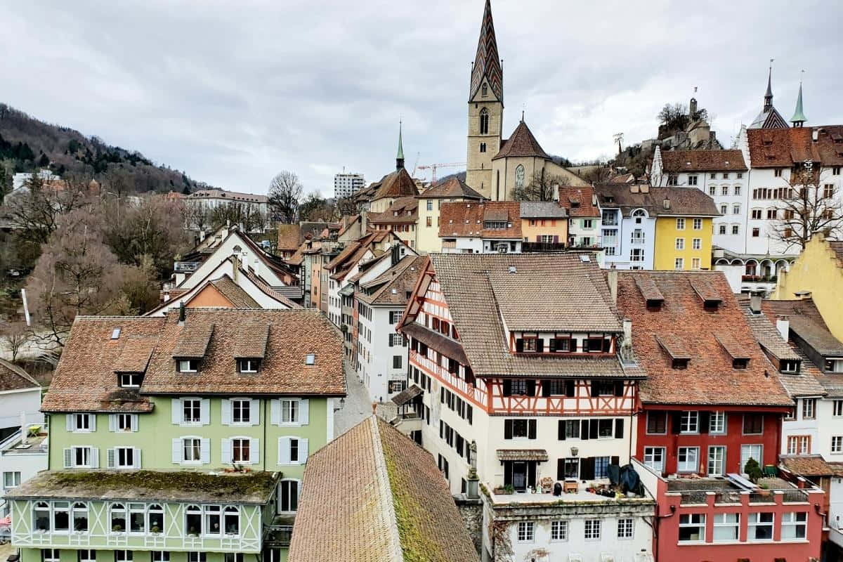 The Enchanting Cityscape Of Baden, Switzerland Illuminated In The Twilight Wallpaper