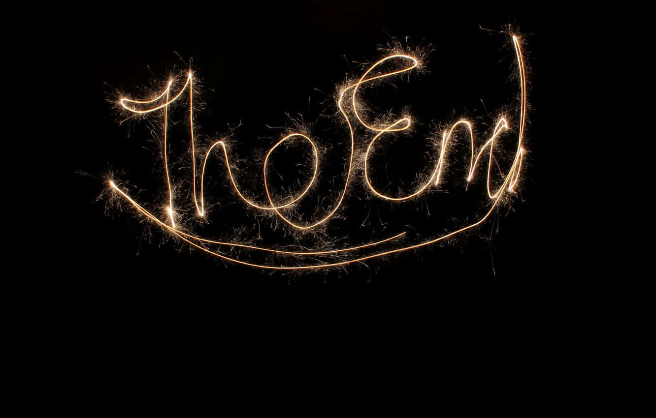 The End Written With Sparklers On A Black Background Wallpaper