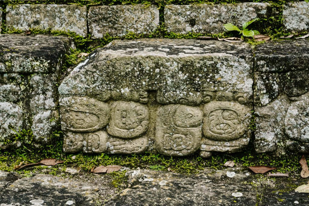The Enigmatic Mayan Ruins Of Copan Under A Brilliant Blue Sky Wallpaper
