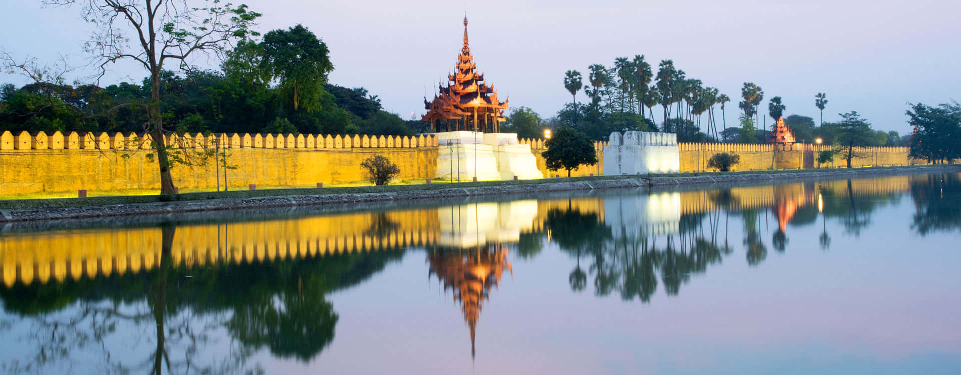 The Golden Mandalay Palace Walls In An Evening Scene Wallpaper