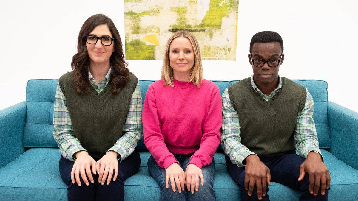 The Good Place Characters Formally Seated On A Couch Wallpaper