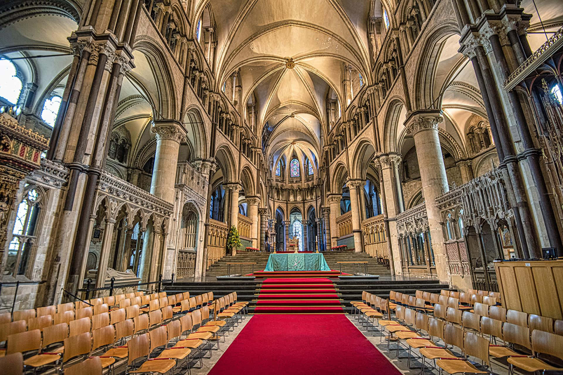 The Grand Red Carpet In The Center Of Canterbury Cathedral's Quire Wallpaper