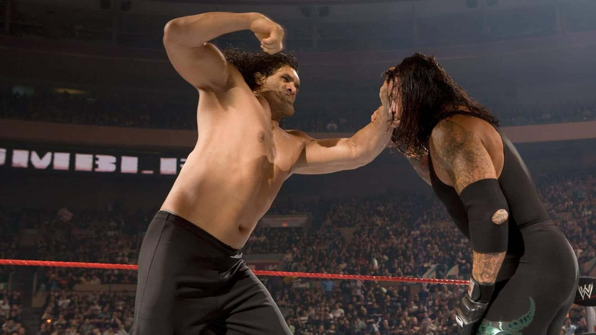 Den store Khali mod Undertaker. Wallpaper