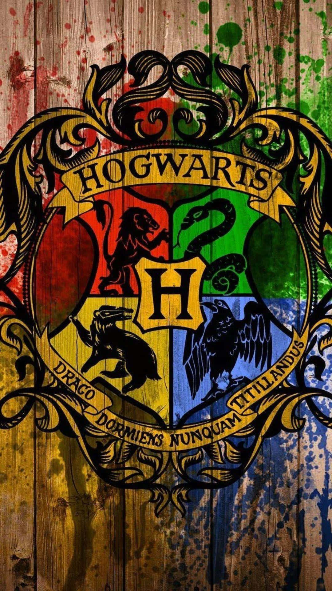 The four houses of Hogwarts - Gryffindor, Ravenclaw, Hufflepuff and Slytherin Wallpaper