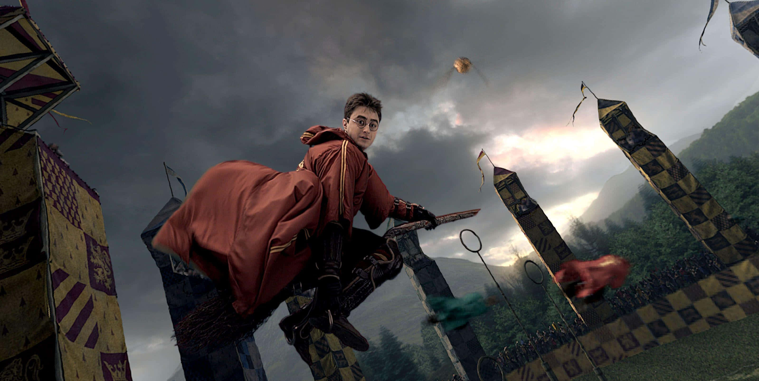 The Hogwarts Quidditch Team soars through the skies. Wallpaper