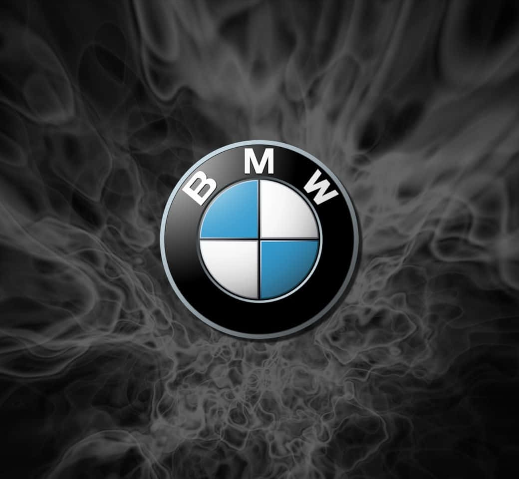 The Iconic Emblem Of Bmw Against A Sleek Black Background. Wallpaper