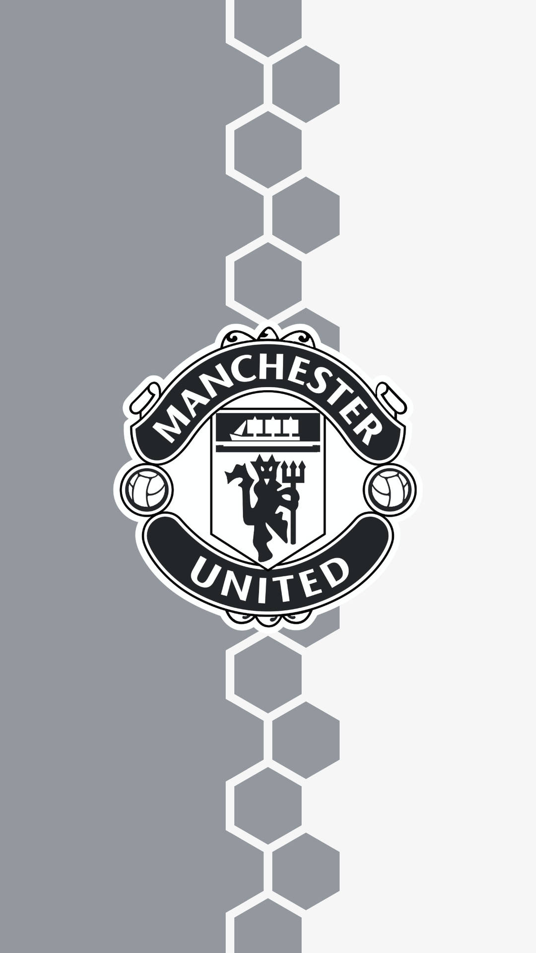 The Iconic Manchester United Logo Proudly Shining On A Red Background. Wallpaper