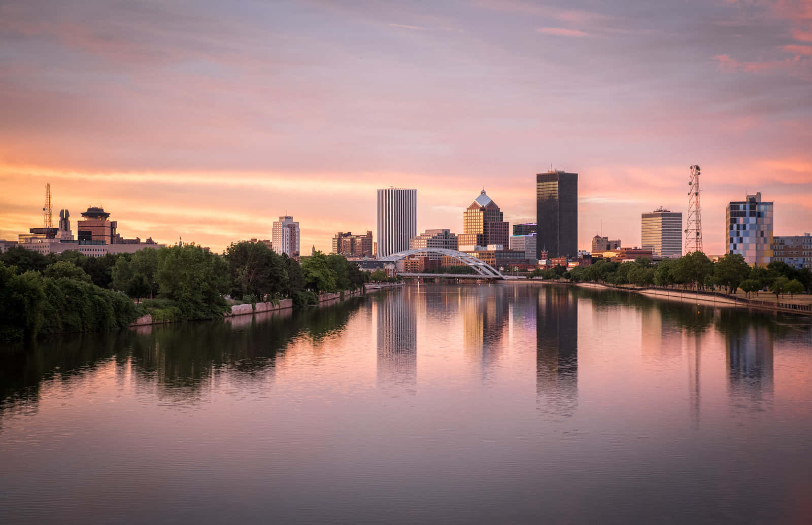 The Iconic Skyline Of Rochester, New York, Bathed In The Glow Of A Stunning Sunset. Wallpaper