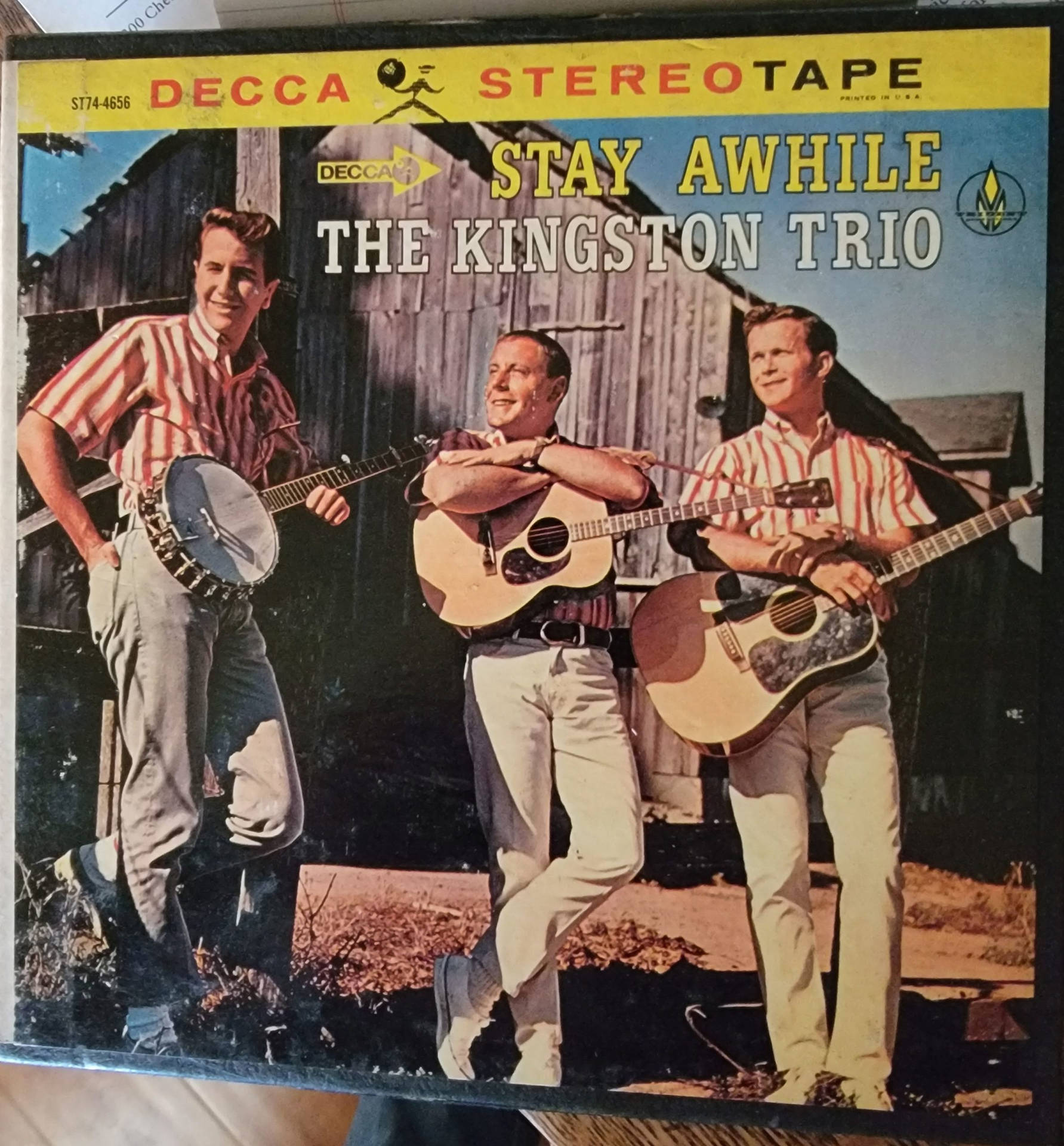 The Kingston Trio Posing with their Album "Stay Awhile" Wallpaper