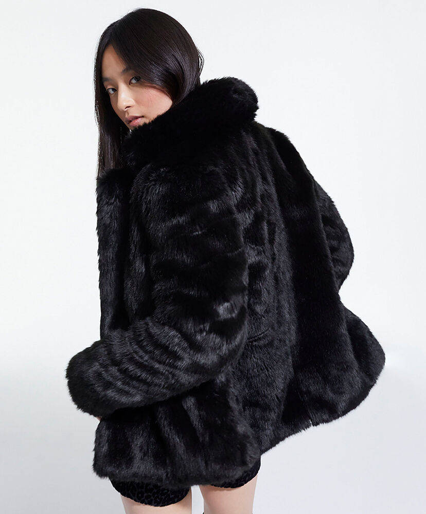 Elevate Your Style with The Kooples Black Fur Coat Wallpaper