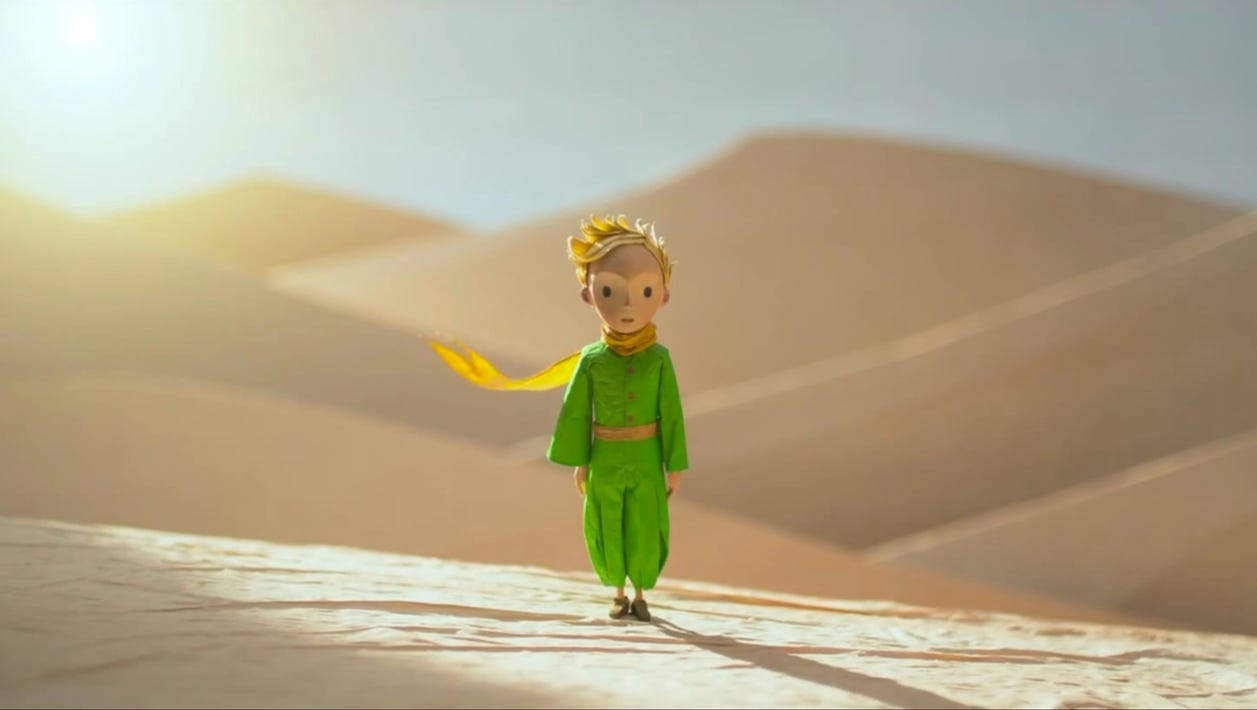 The Little Prince Standing On Sand Wallpaper