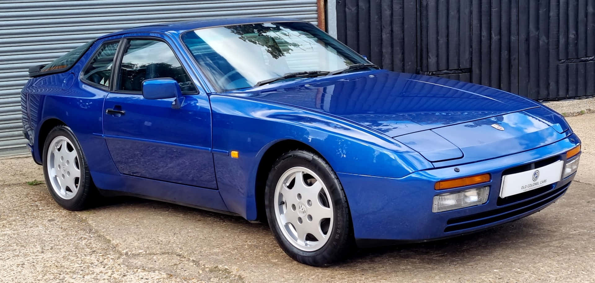 The Luxurious Porsche 944 In Vibrant Red Wallpaper