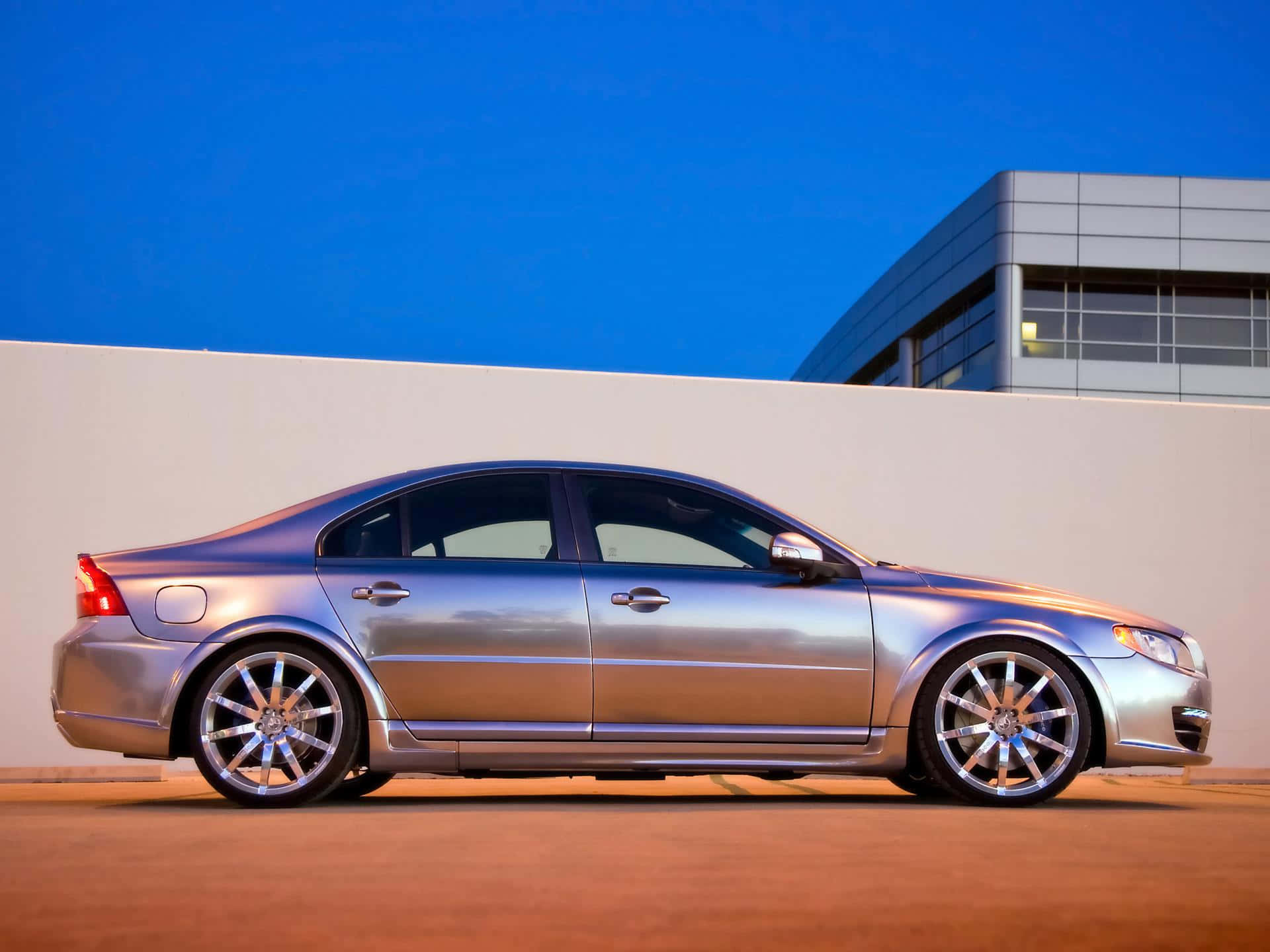 The Luxurious Volvo S80 Gliding On The Highway Wallpaper