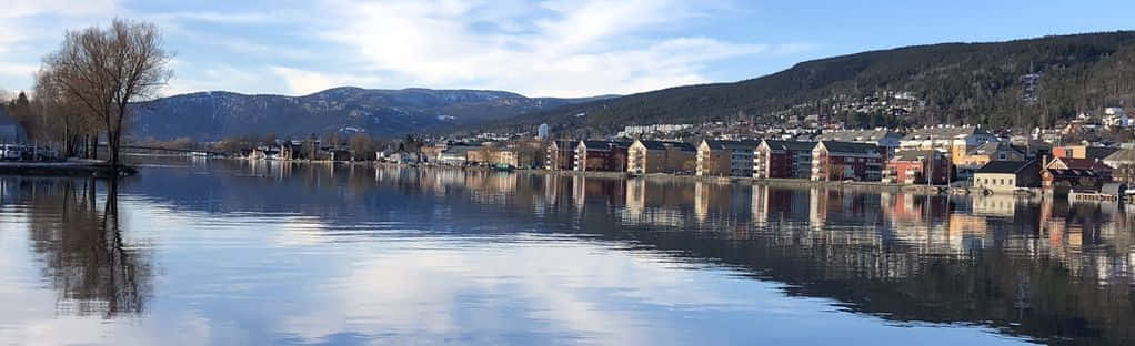 The Majestic Essence Of Drammen City In The Twilight Wallpaper