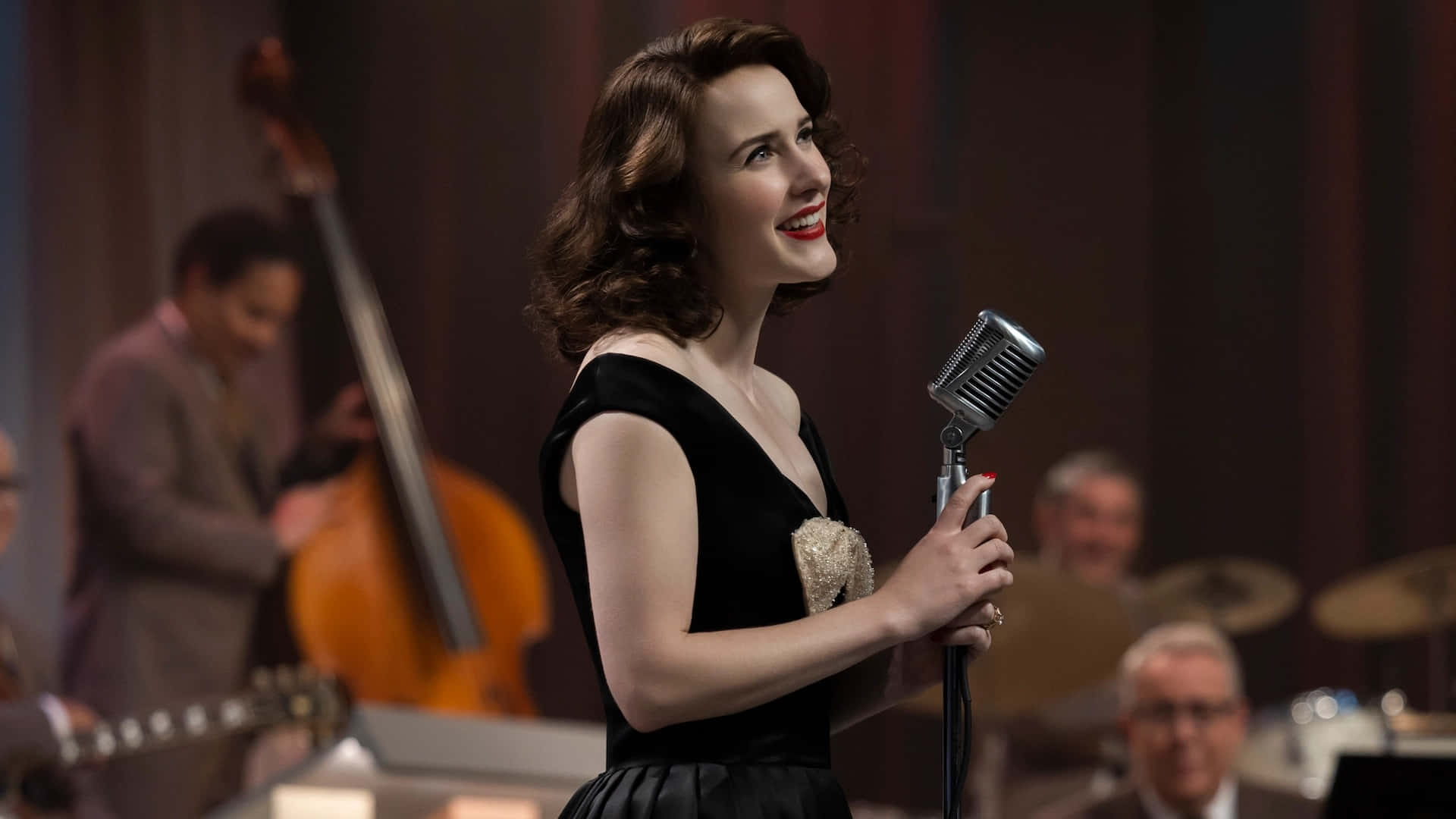 The Marvelous Mrs. Maisel Standing In The Spotlight On Stage Wallpaper