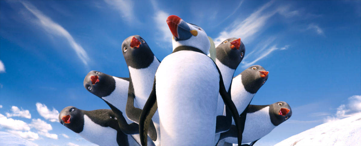 Ungrupo De Pingüinos Parados En La Nieve Fondo de pantalla