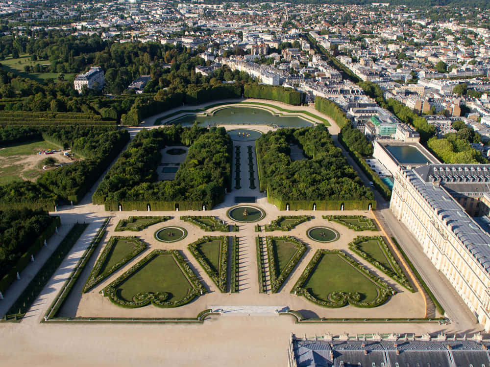 De nordlige og sydlige parterrer af paladset Versailles Wallpaper