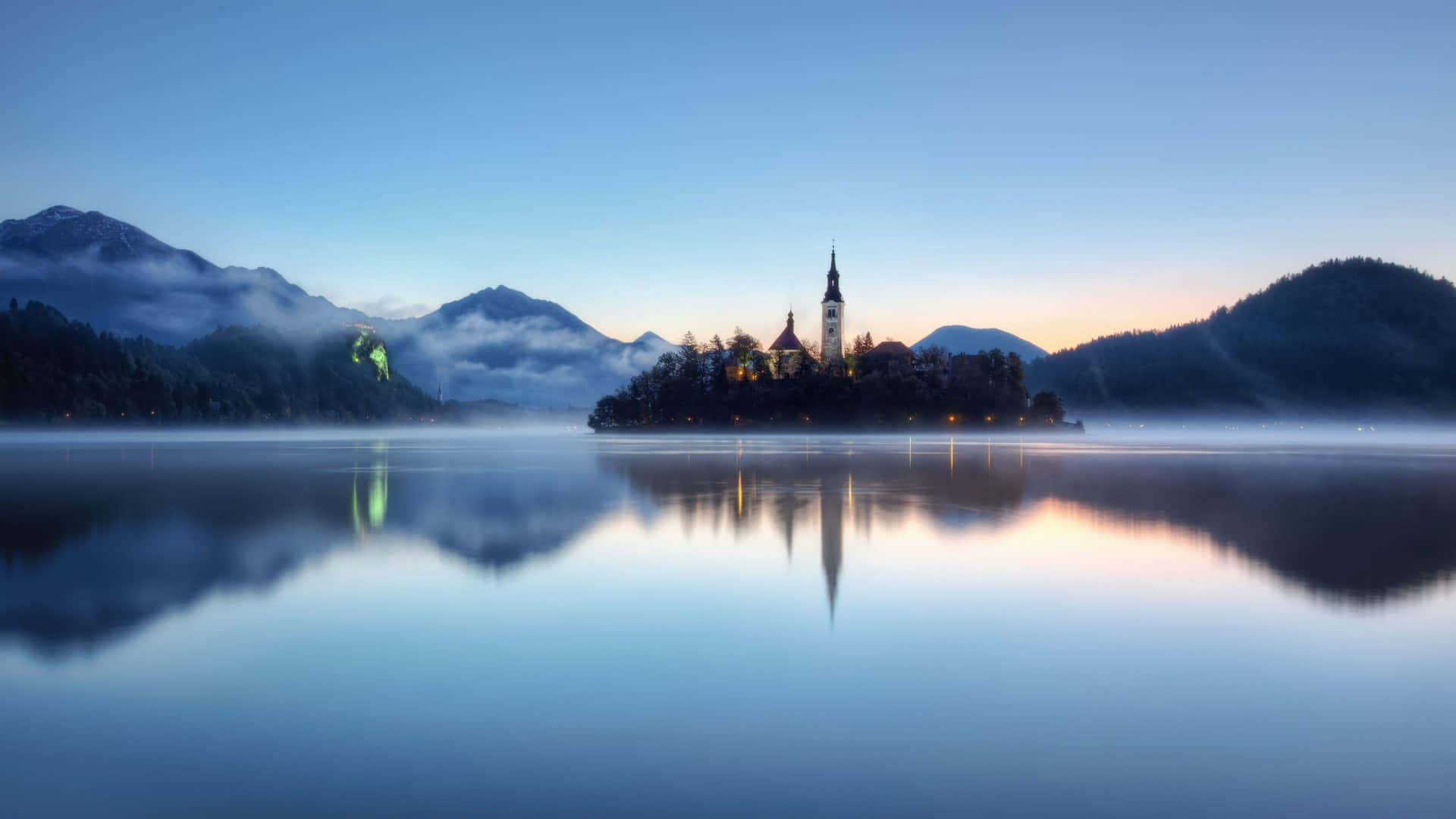 The Peaceful Lake Bled At Daybreak Wallpaper
