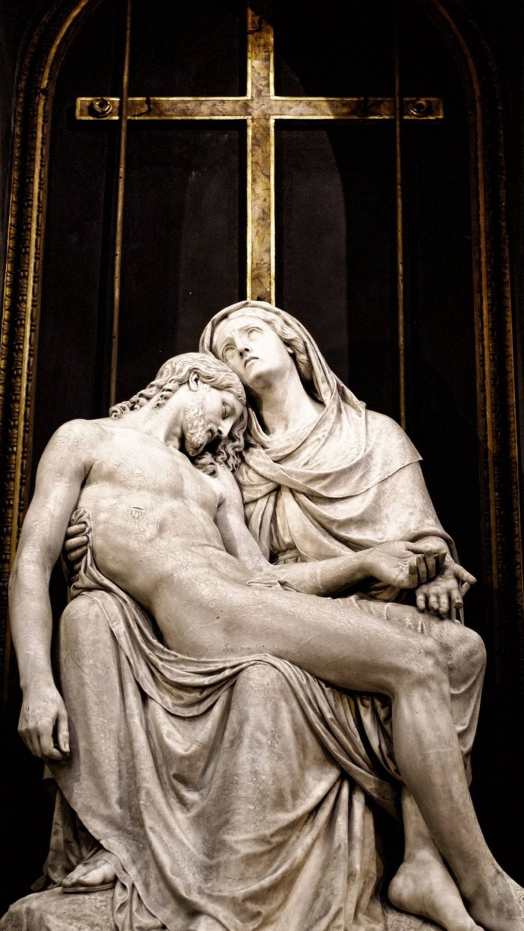 Det Pietà Jesus 4K iPhone tapete smukt forestiller Maria omfavne kroppen af Jesus. Wallpaper