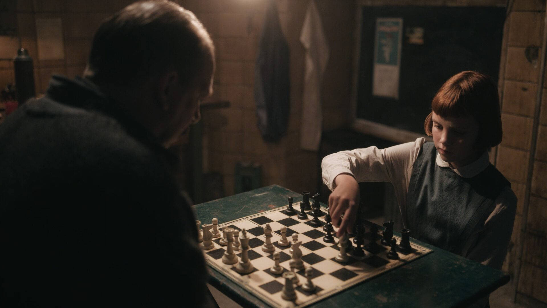 Mr. Shaibel teaches Beth, a young chess prodigy, in 'The Queen's Gambit'. Wallpaper