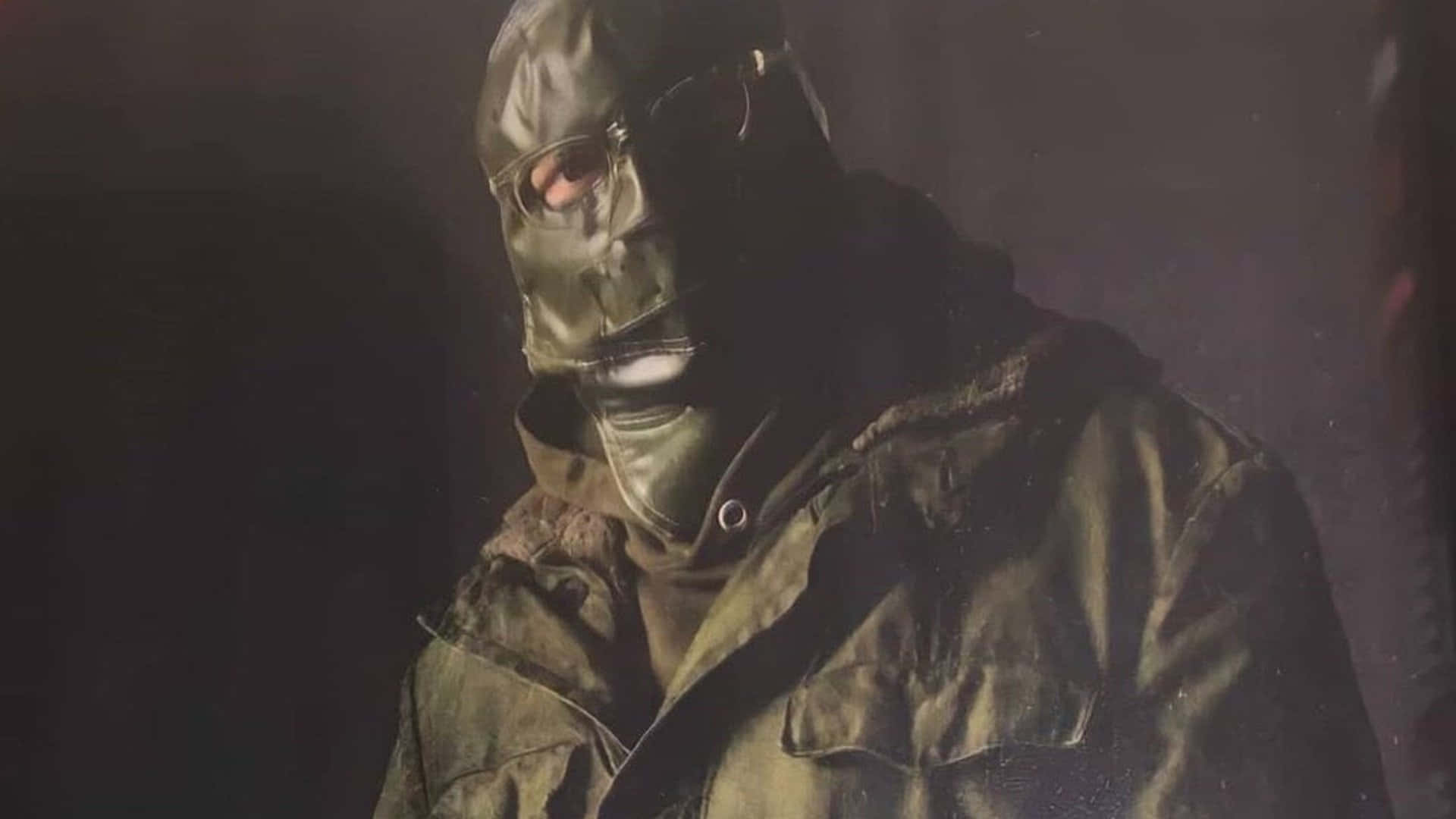 A Man In A Green Jacket And A Mask Wallpaper