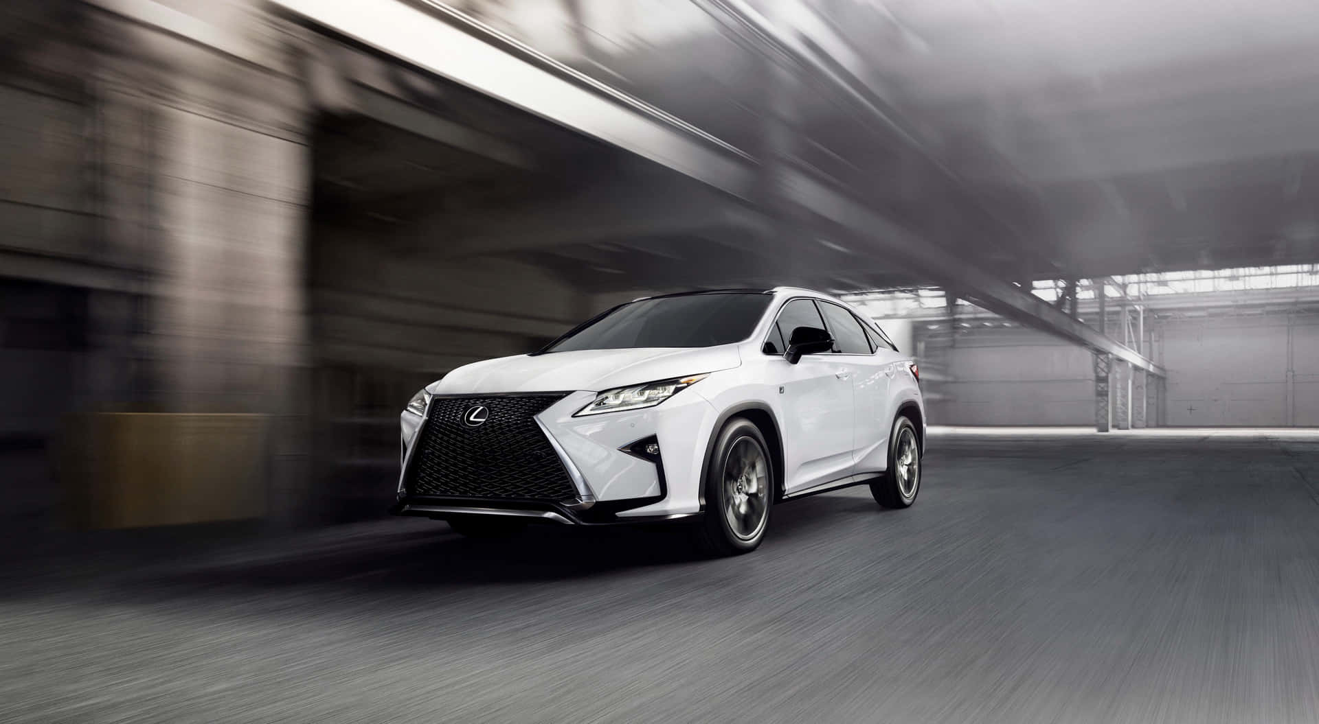 The Stylish And Elegant Lexus Rx Cruising Downtown. Wallpaper