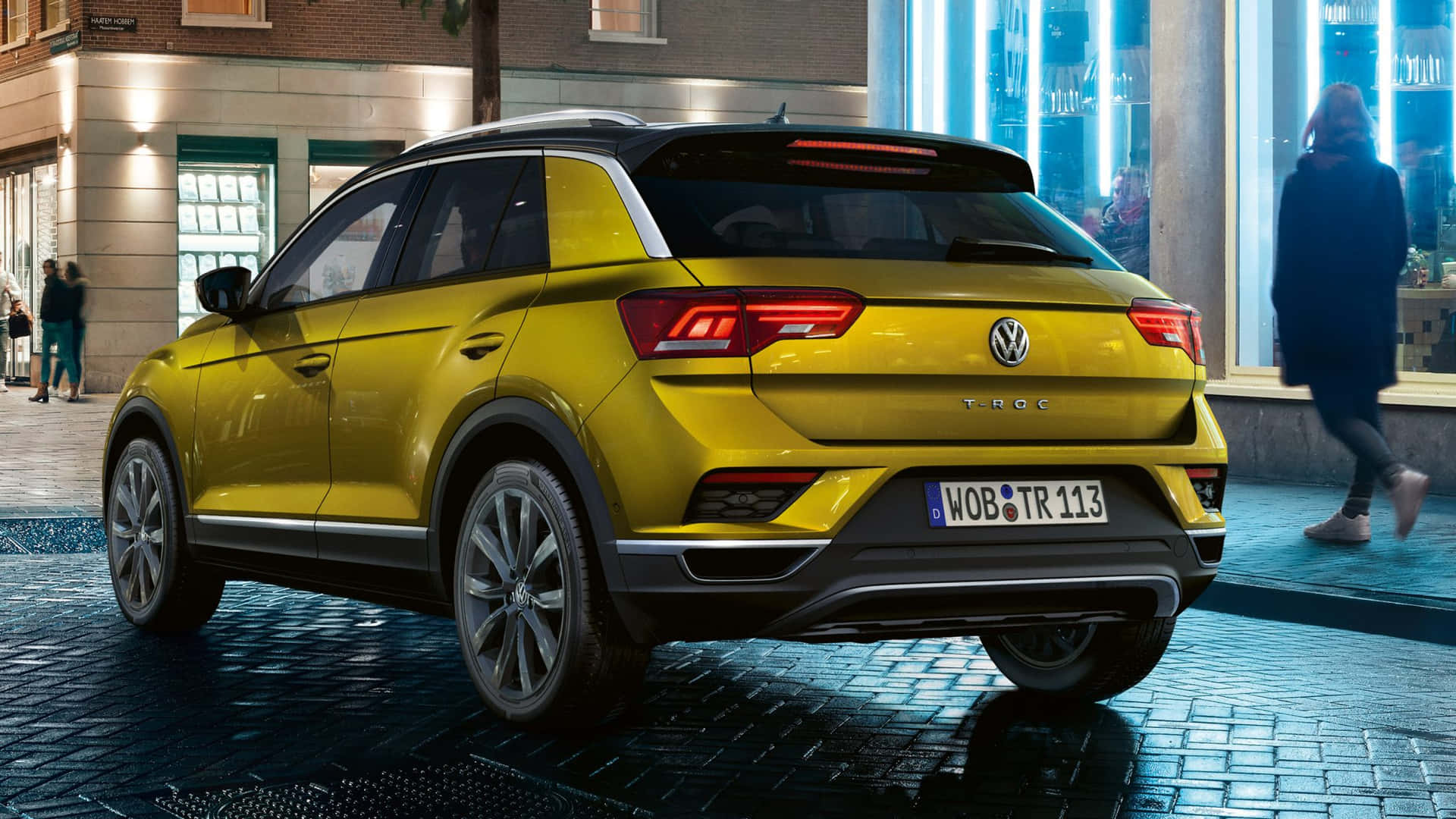 The Stylish And Powerful Volkswagen T-roc On The Move Wallpaper