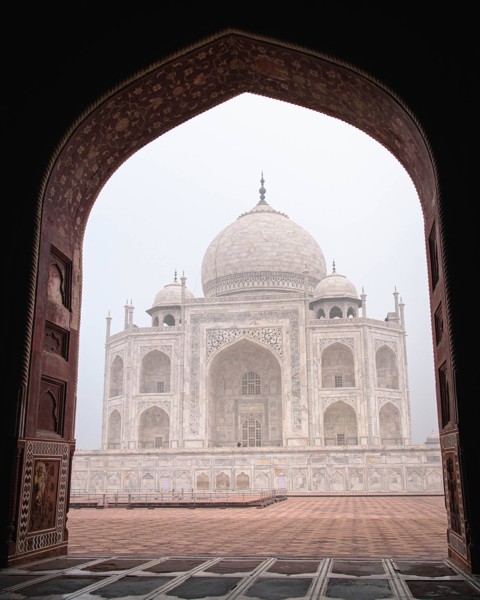 The Taj Mahal Inside A Doorway Wallpaper