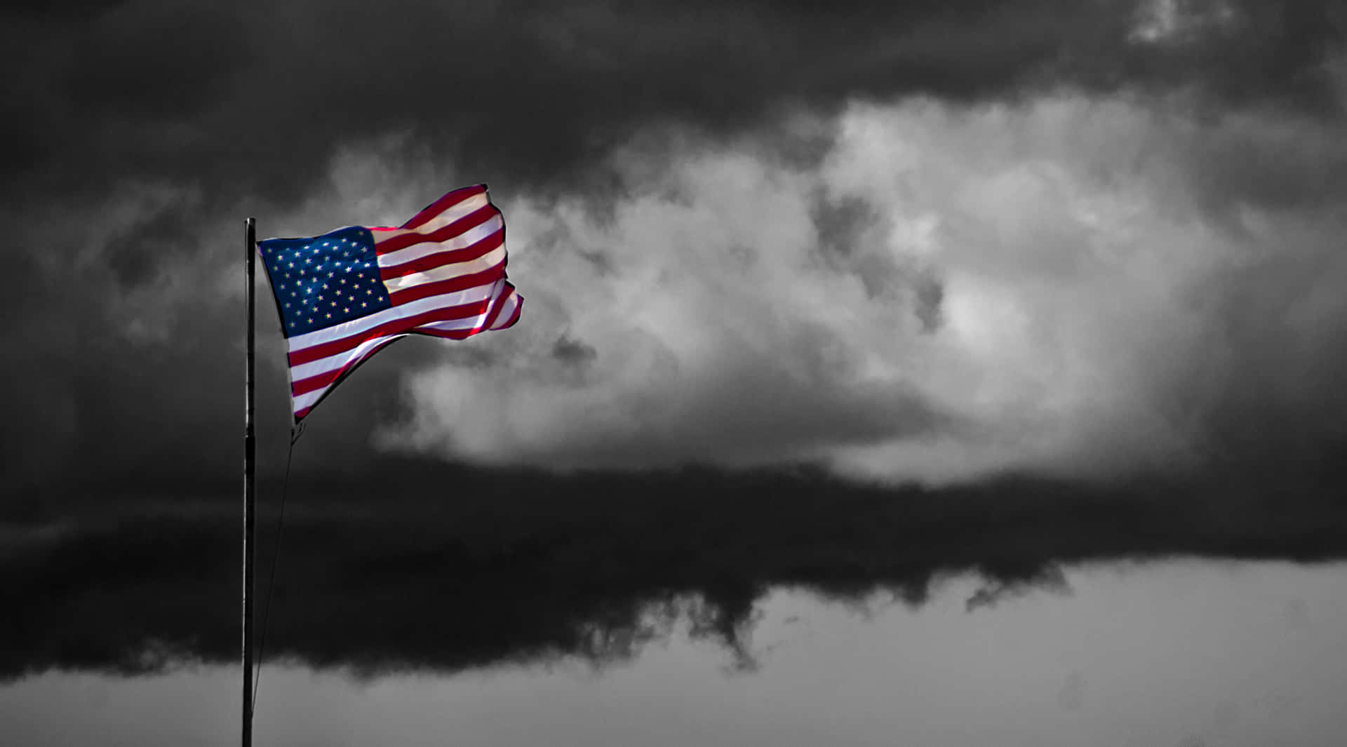 The United States Of America's Flag Waves Proudly Against A Vivid Sky Wallpaper