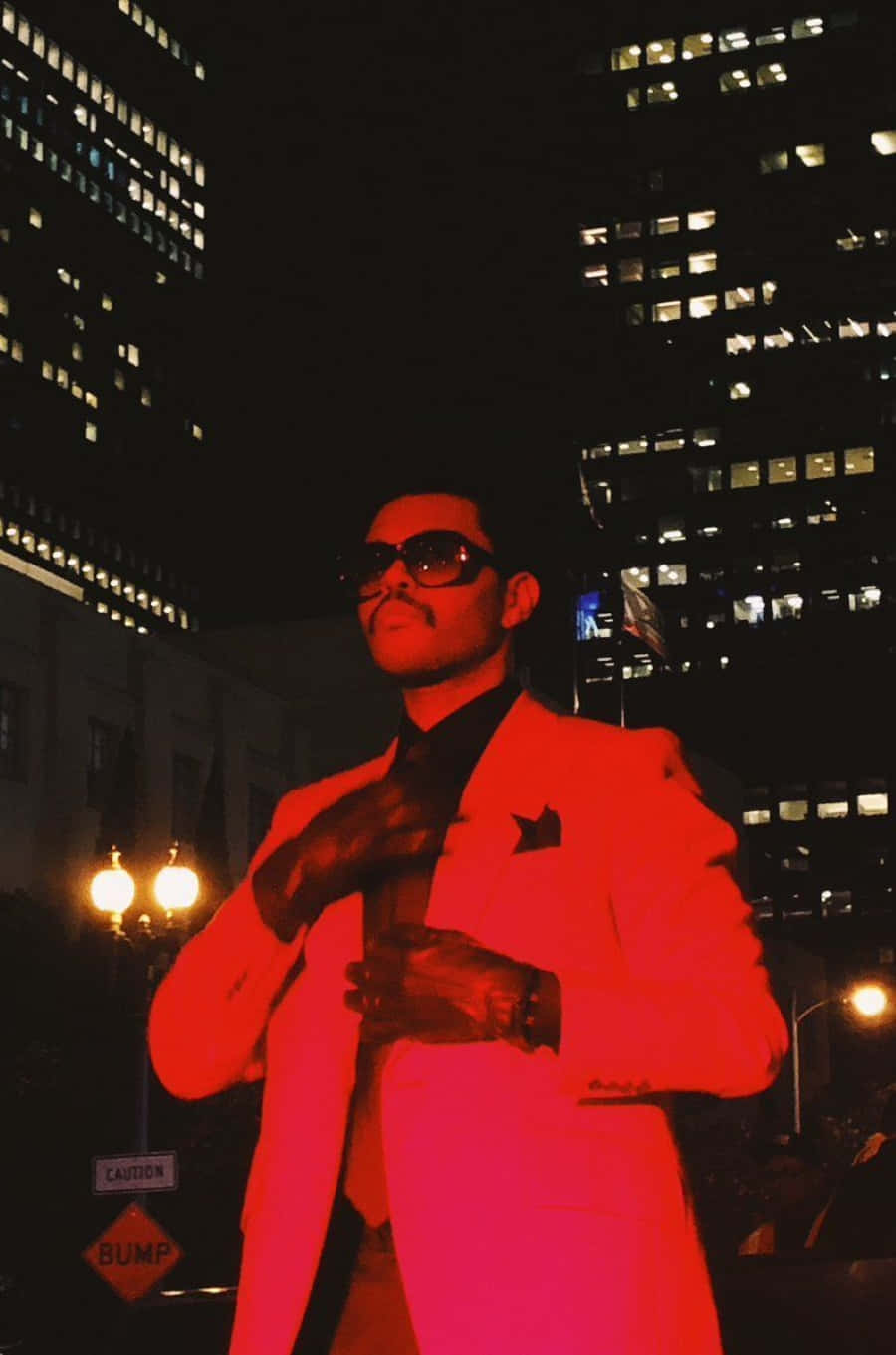The Weeknd posing in red suit during the After Hours era Wallpaper