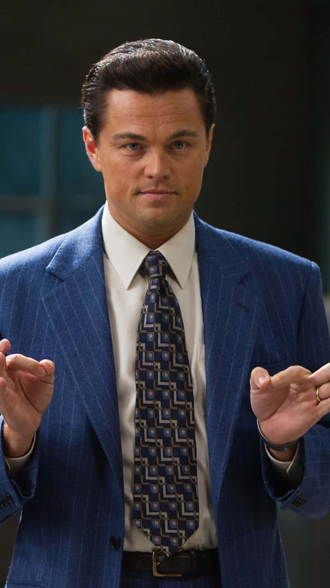 Leonardo DiCaprio embracing his iconic role as Jordan Belfort in The Wolf Of Wall Street Wallpaper