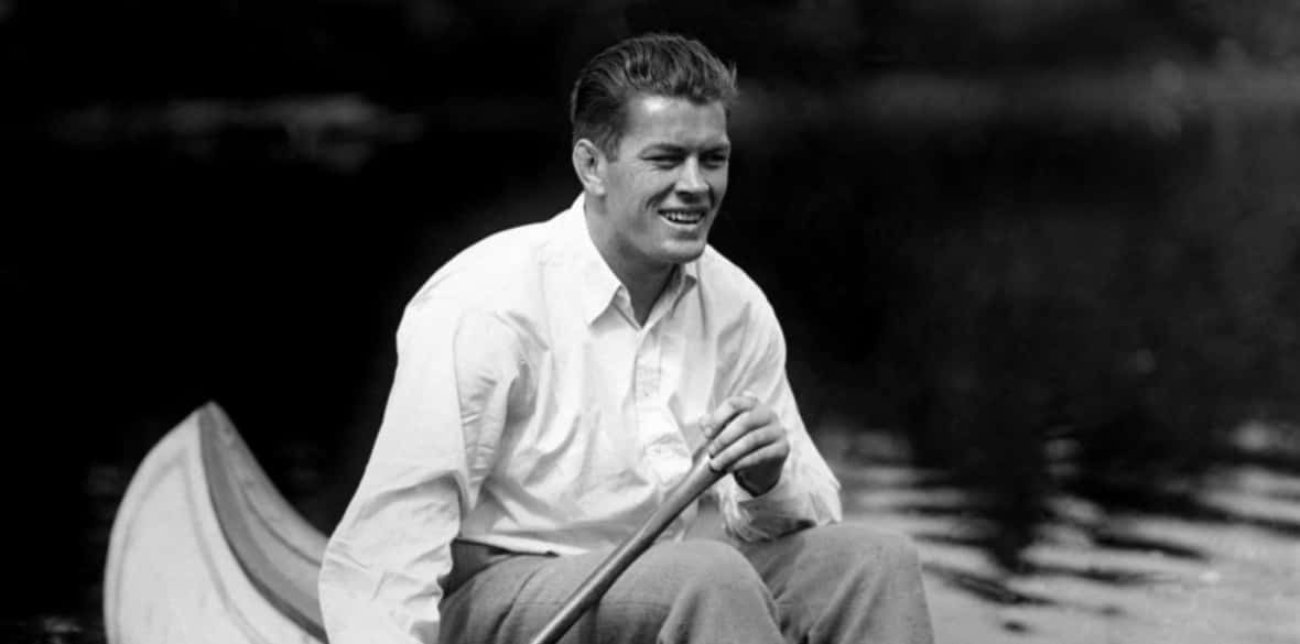 The Young Gene Tunney Sailing A Boat Wallpaper