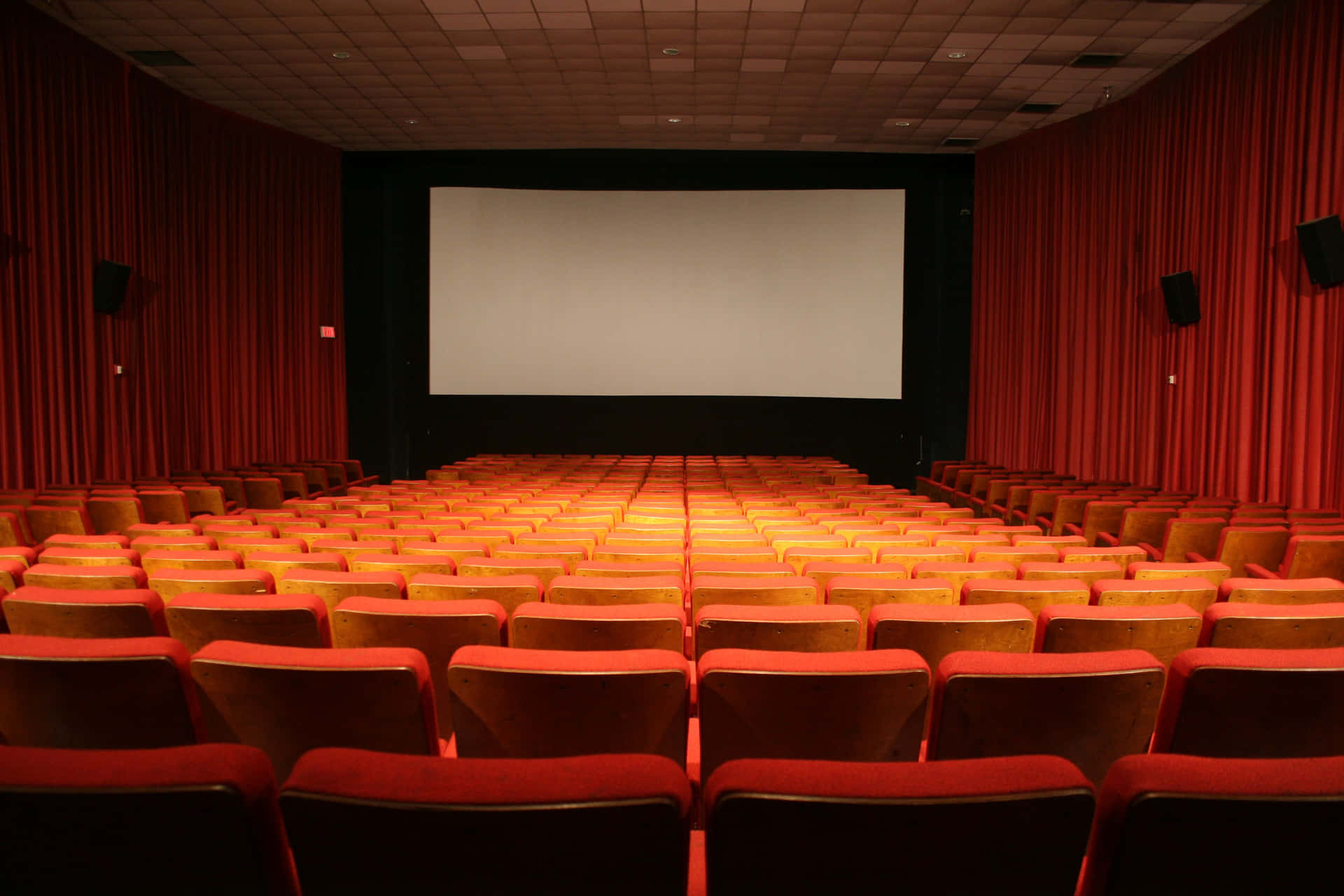 A Large Theater With Red Chairs
