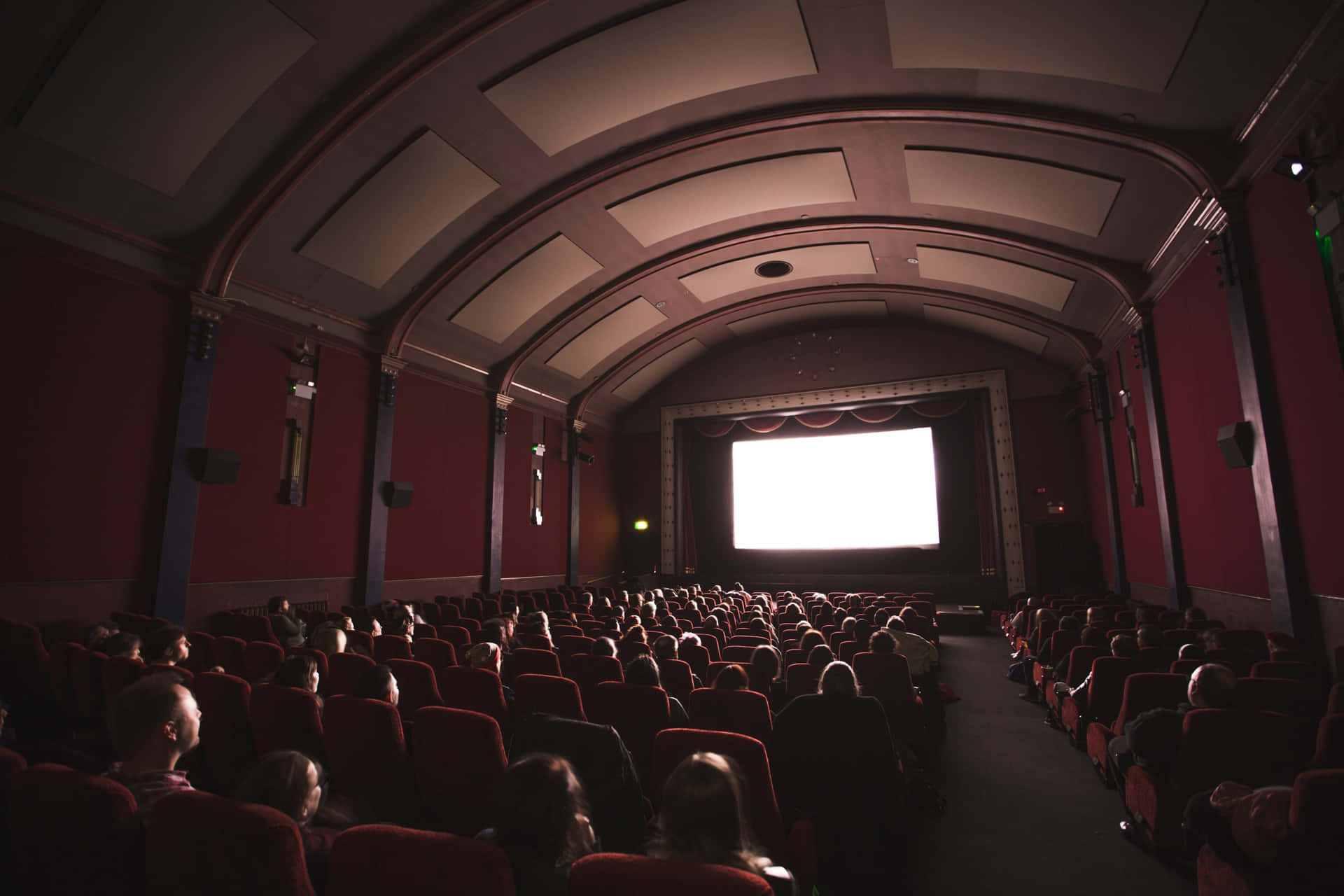 A Large Auditorium With A Screen
