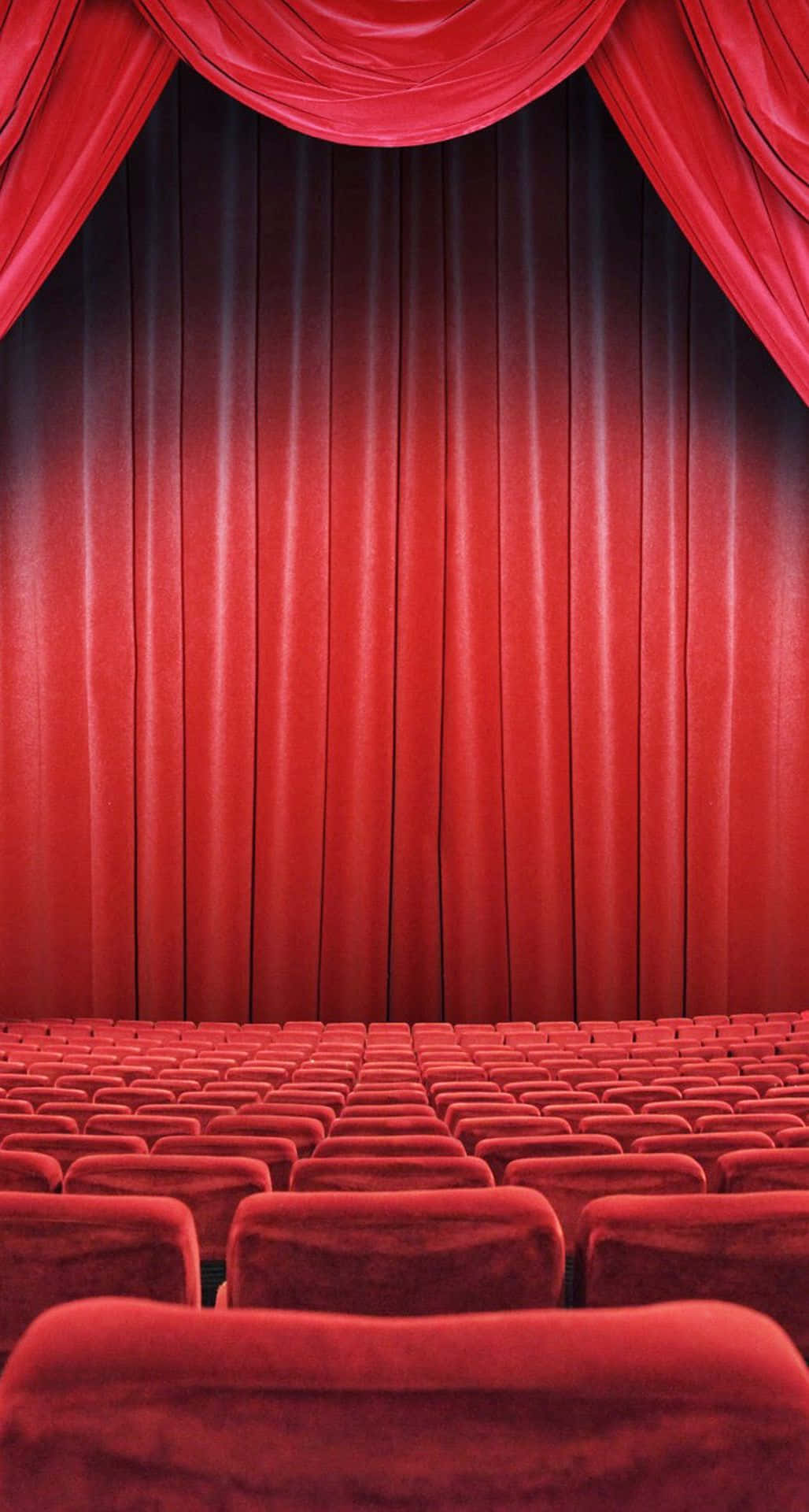 Theater With Red Seats And Curtains Wallpaper