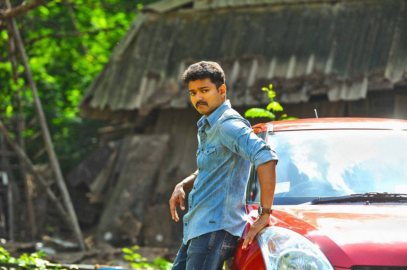 Download Theri Movie Vijay And Red Car Wallpaper | Wallpapers.com