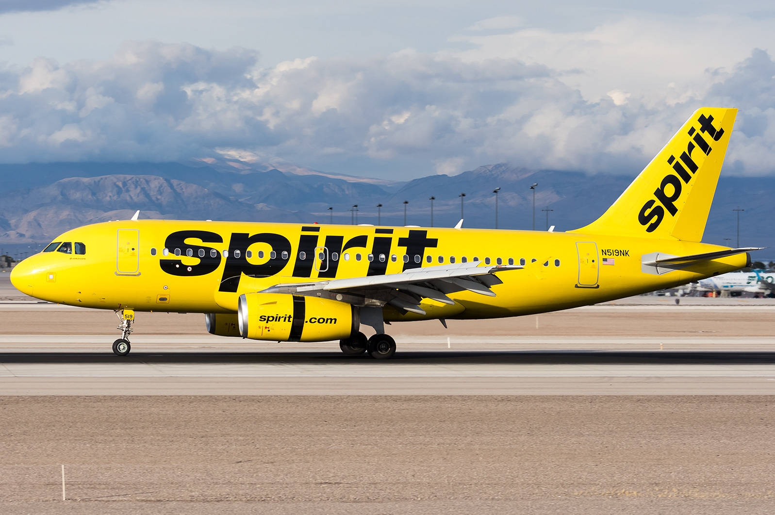 Thick Clouds Spirit Airlines Plane Background