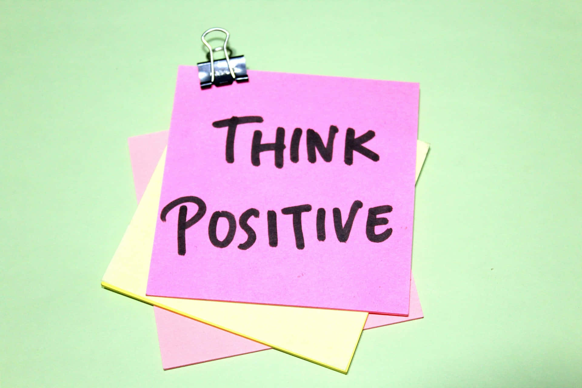 Think Positive Note Clippedto Paper Stack Wallpaper