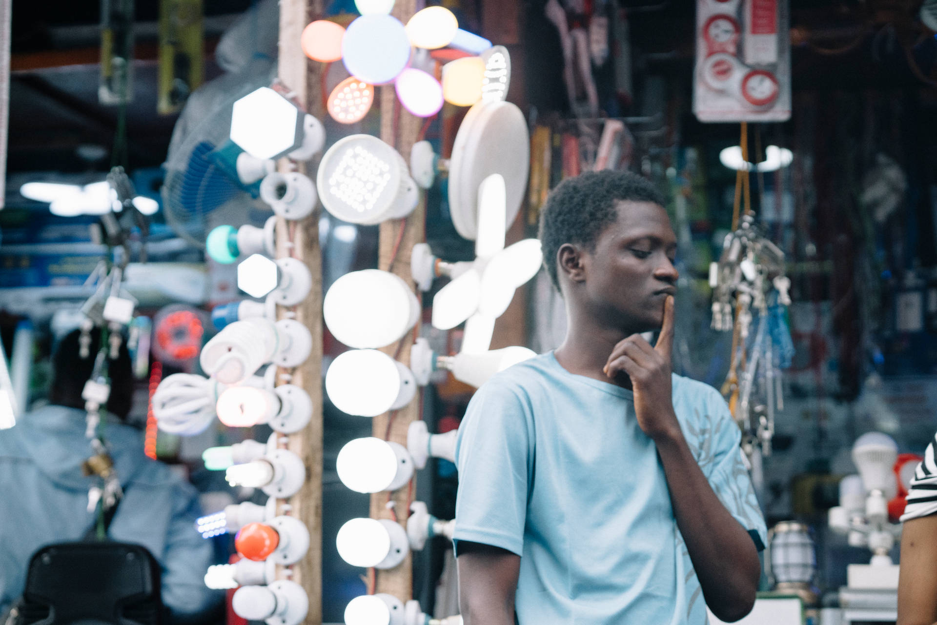 Thinking Man Beside Lights In Sierra Leone